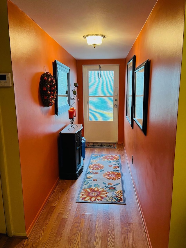 doorway to outside with light hardwood / wood-style floors