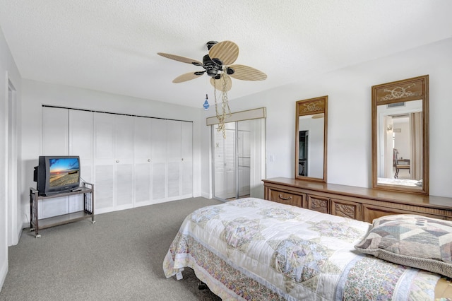 carpeted bedroom with a textured ceiling and ceiling fan