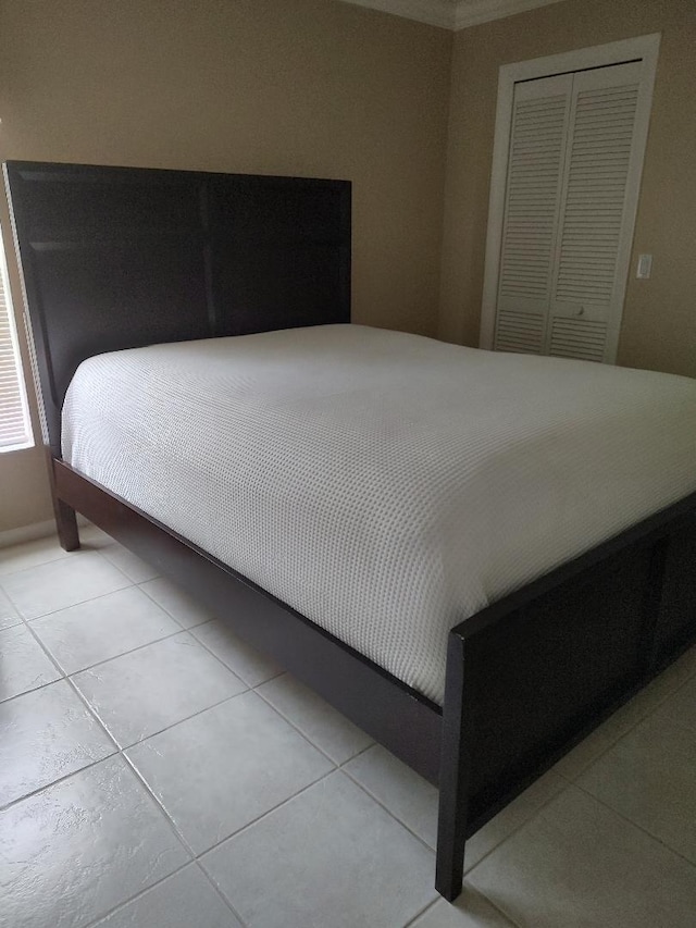 bedroom with a closet and tile flooring