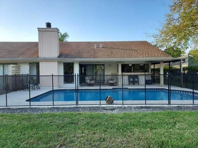 view of pool with a lawn and a patio area