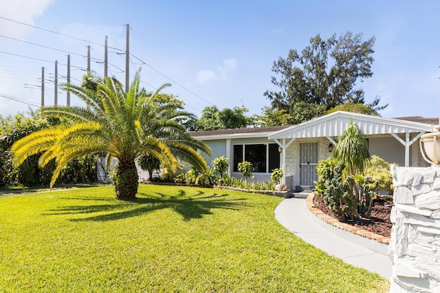 single story home featuring a front yard