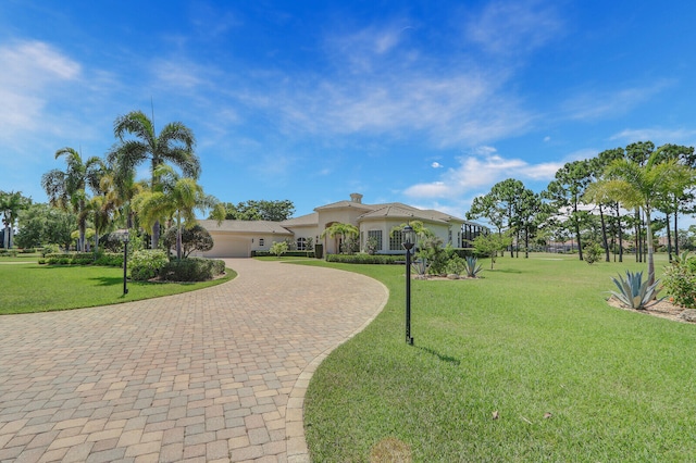 exterior space with a garage and a front yard