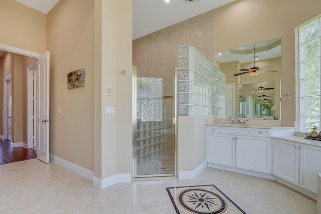 bathroom featuring plenty of natural light, an enclosed shower, ceiling fan, and hardwood / wood-style flooring