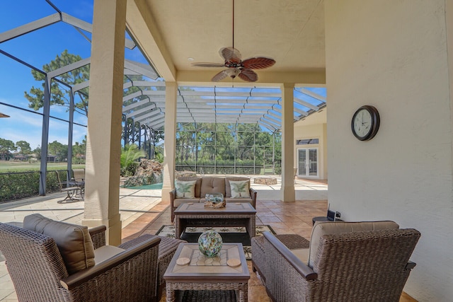 view of terrace with ceiling fan, an outdoor hangout area, and glass enclosure