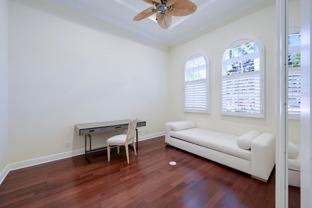 living area featuring ornamental molding, ceiling fan, and dark hardwood / wood-style flooring