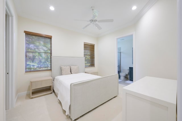 bedroom featuring ceiling fan, ensuite bathroom, and crown molding