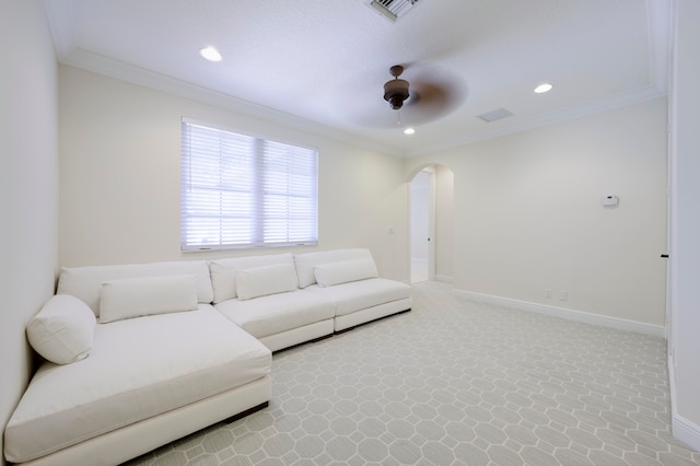 living room featuring ceiling fan and crown molding