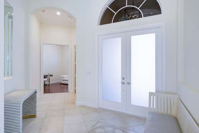 entrance foyer with french doors and light tile flooring