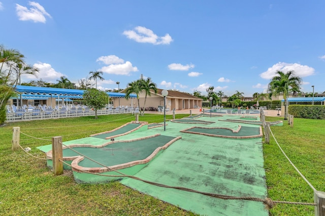 view of home's community with a lawn