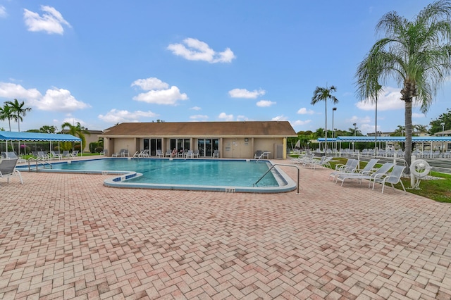 view of swimming pool with a patio