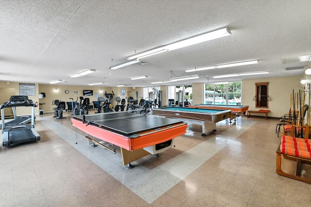 recreation room featuring billiards, light tile patterned floors, and a textured ceiling