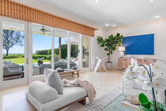 tiled living room with ceiling fan and ornamental molding