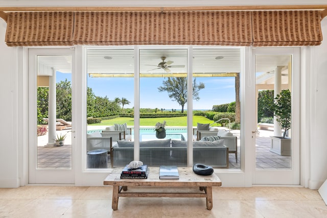 doorway to outside with a wealth of natural light and light tile floors