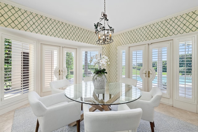 tiled dining area with a notable chandelier and crown molding