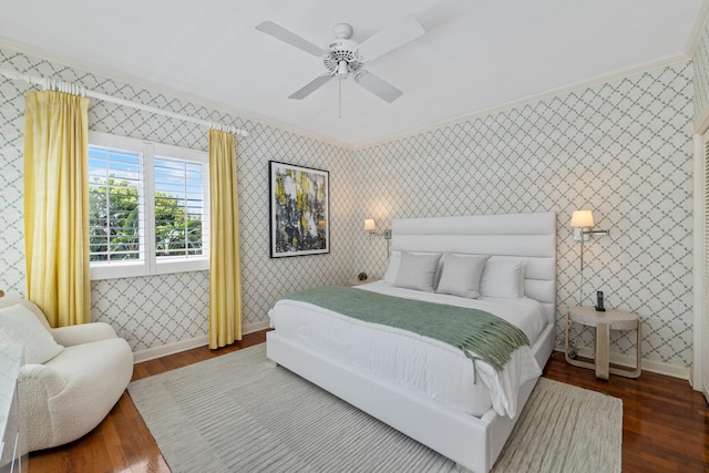 bedroom with wood-type flooring, ceiling fan, and ornamental molding