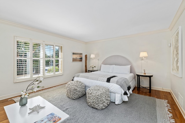 bedroom featuring wood-type flooring and crown molding