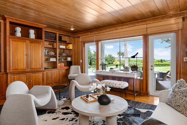 living room with wood ceiling, wood walls, light hardwood / wood-style flooring, and built in features