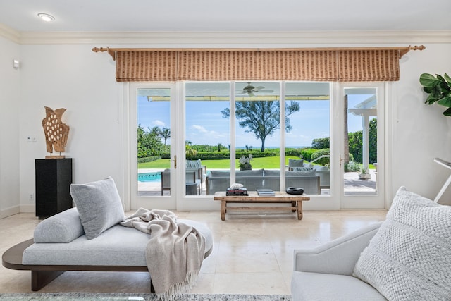 living room featuring crown molding, tile floors, and a wealth of natural light