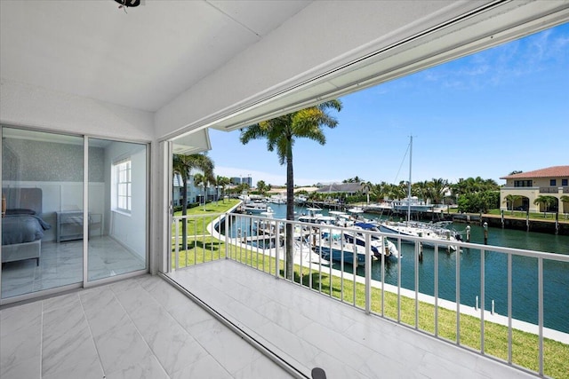 unfurnished sunroom with a water view