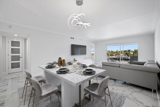 tiled dining space featuring an inviting chandelier and ornamental molding