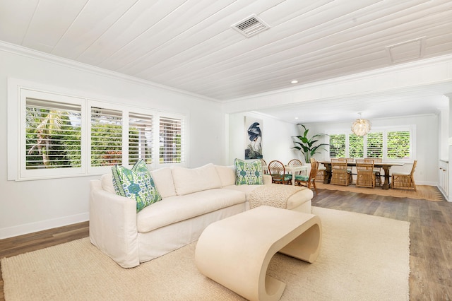 living room featuring ornamental molding and hardwood / wood-style floors