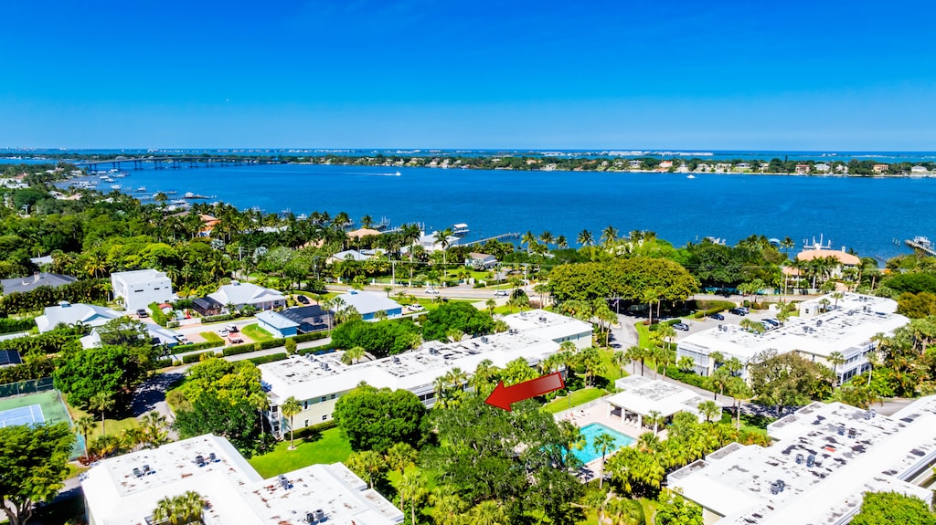 birds eye view of property with a water view