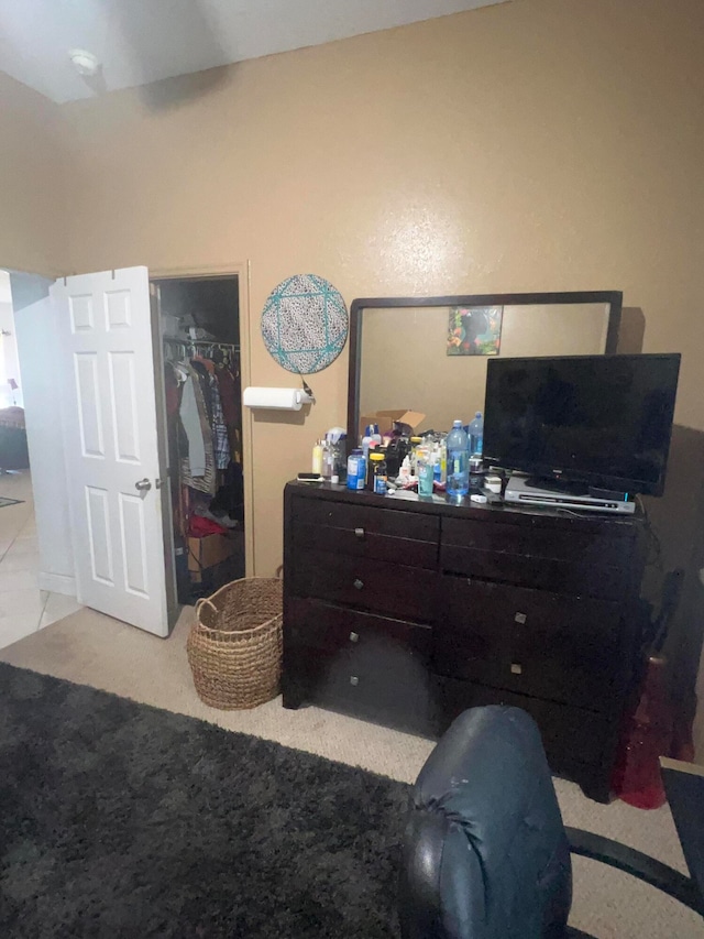 carpeted bedroom with a closet