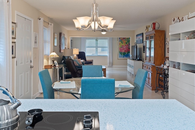 tiled dining area with an inviting chandelier