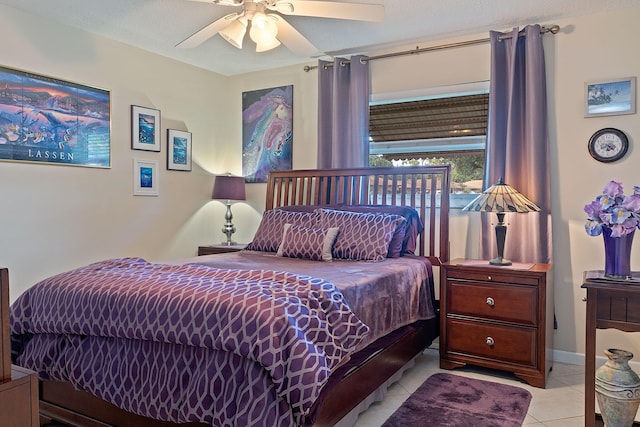 tiled bedroom featuring a textured ceiling and ceiling fan