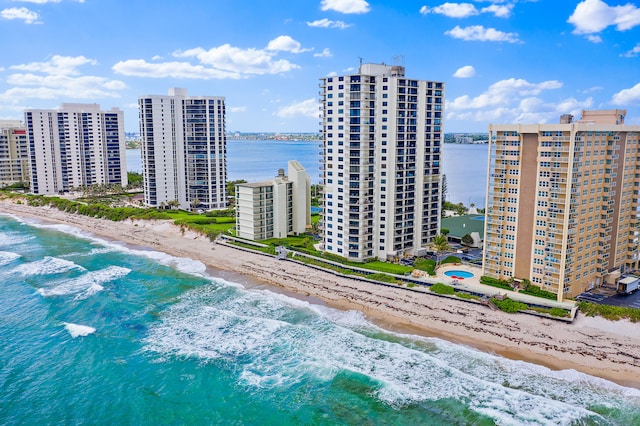 bird's eye view featuring a beach view and a water view