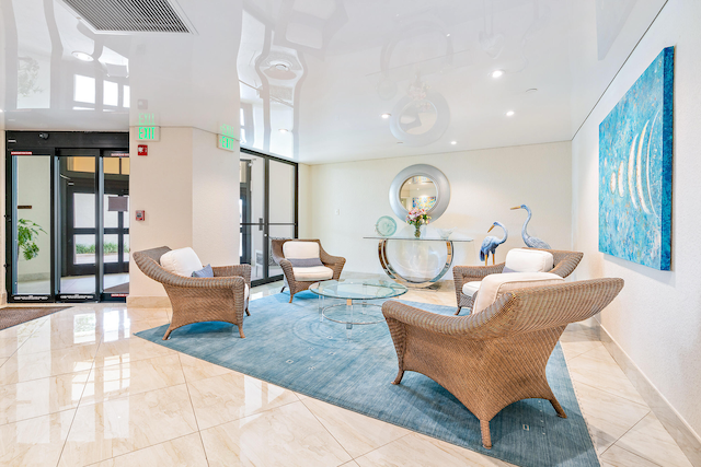 living room featuring a healthy amount of sunlight and light tile floors