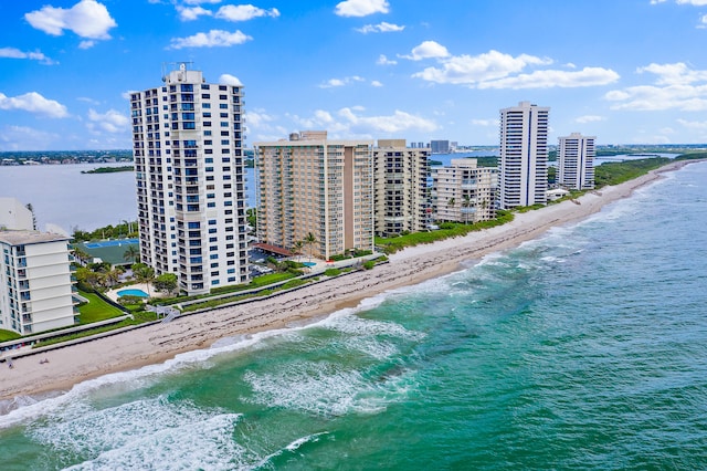 bird's eye view with a water view and a view of the beach