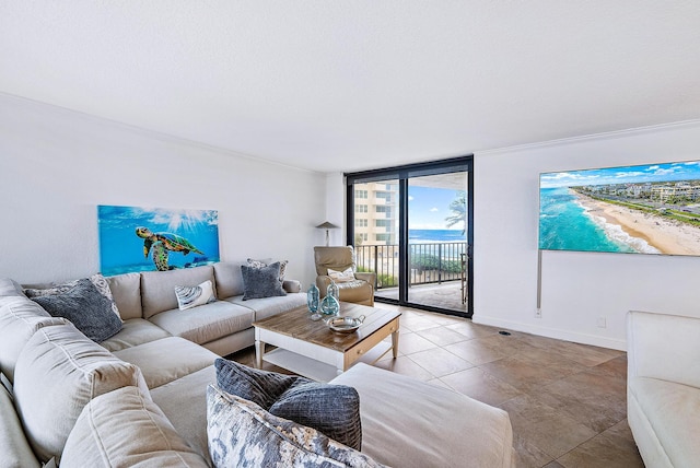 tiled living room featuring a wall of windows, a water view, and ornamental molding