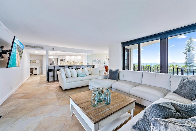 living room featuring light tile flooring