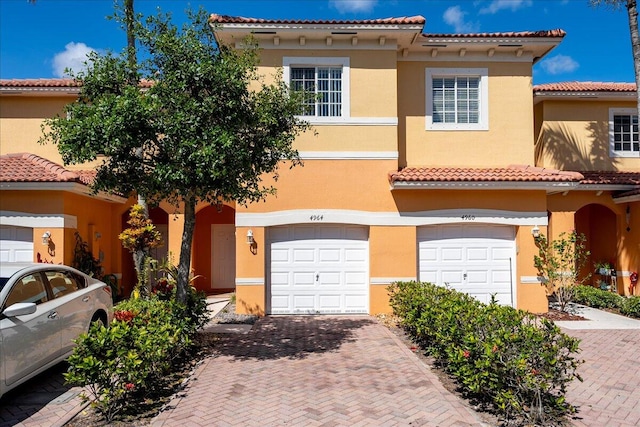 mediterranean / spanish house featuring a garage