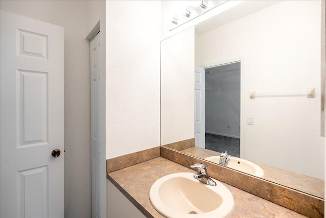 bathroom with vanity with extensive cabinet space