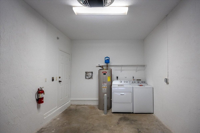 clothes washing area with washer hookup, electric dryer hookup, separate washer and dryer, and electric water heater