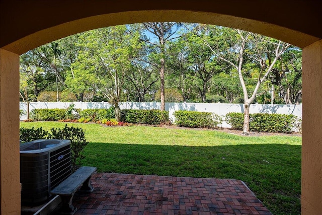 view of yard with a patio and central AC unit