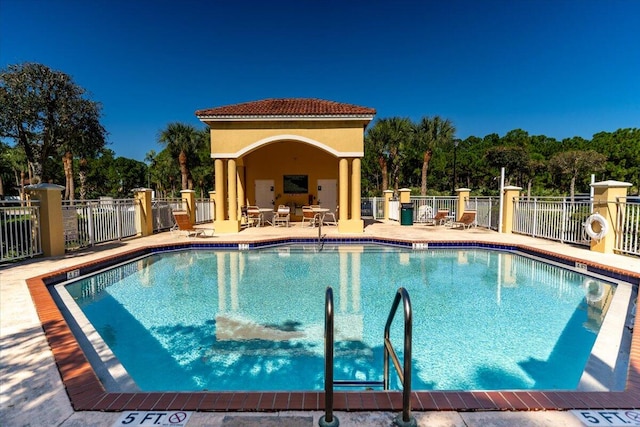 view of swimming pool with a patio area