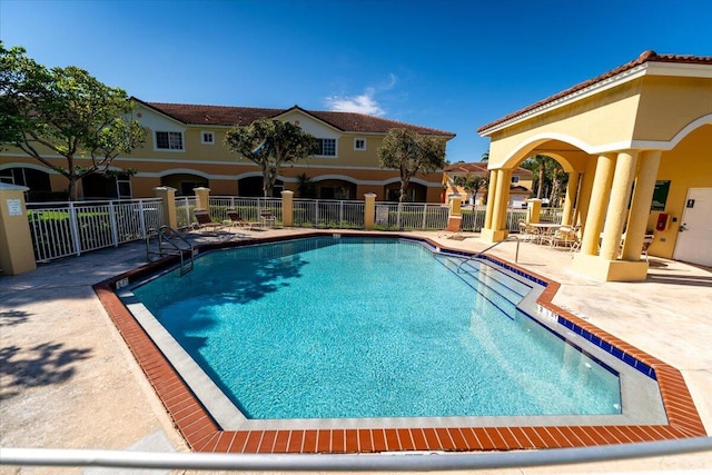 view of swimming pool with a patio