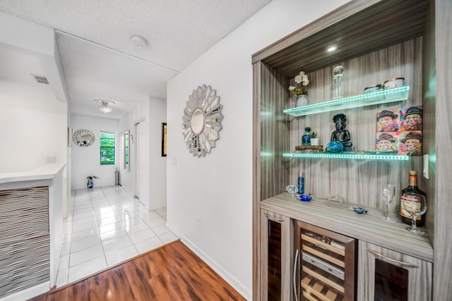 kitchen featuring appliances with stainless steel finishes, tasteful backsplash, white cabinets, and light tile floors