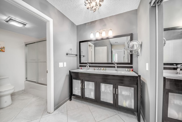 bathroom featuring tile floors, vanity, and toilet