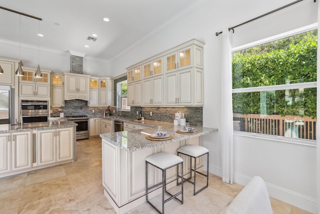 kitchen featuring appliances with stainless steel finishes, tasteful backsplash, light stone counters, ornamental molding, and hanging light fixtures