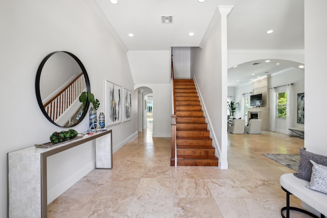 entrance foyer featuring ornamental molding