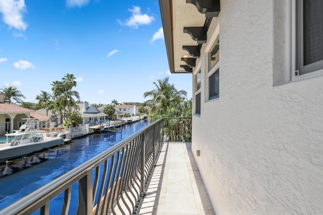 balcony featuring a water view