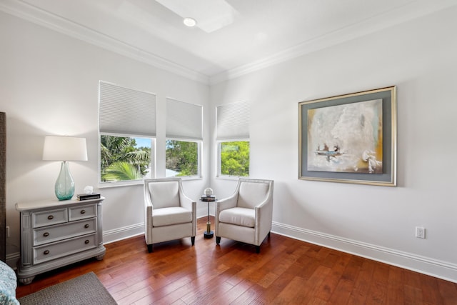 sitting room featuring dark hardwood / wood-style floors and ornamental molding