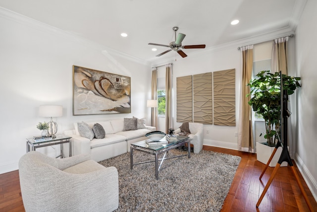 living room with crown molding, ceiling fan, and dark wood-type flooring