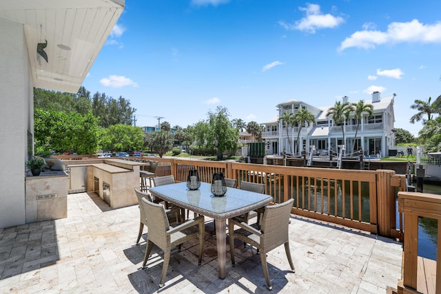 view of patio featuring a water view and area for grilling