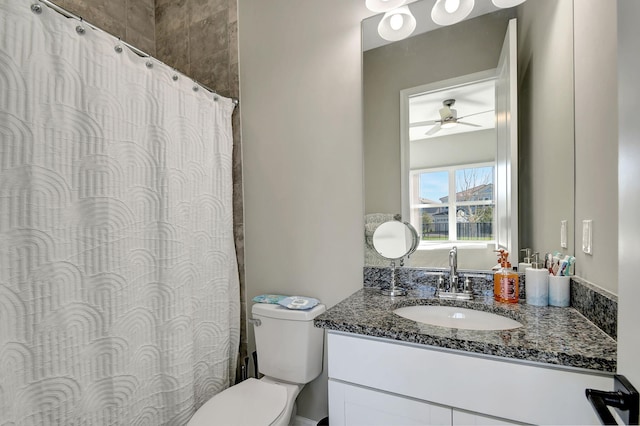 bathroom featuring vanity, ceiling fan, and toilet