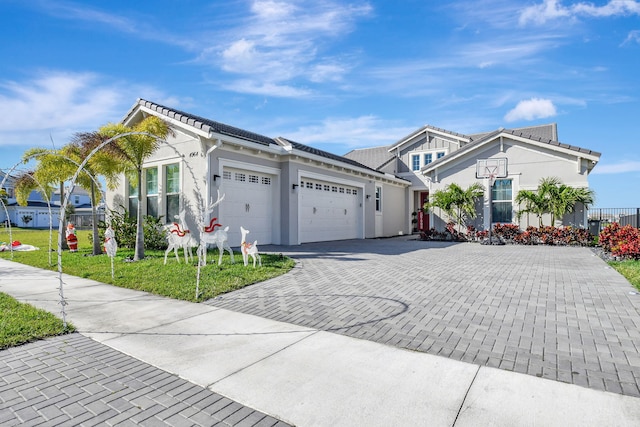 view of front of house with a garage and a front lawn